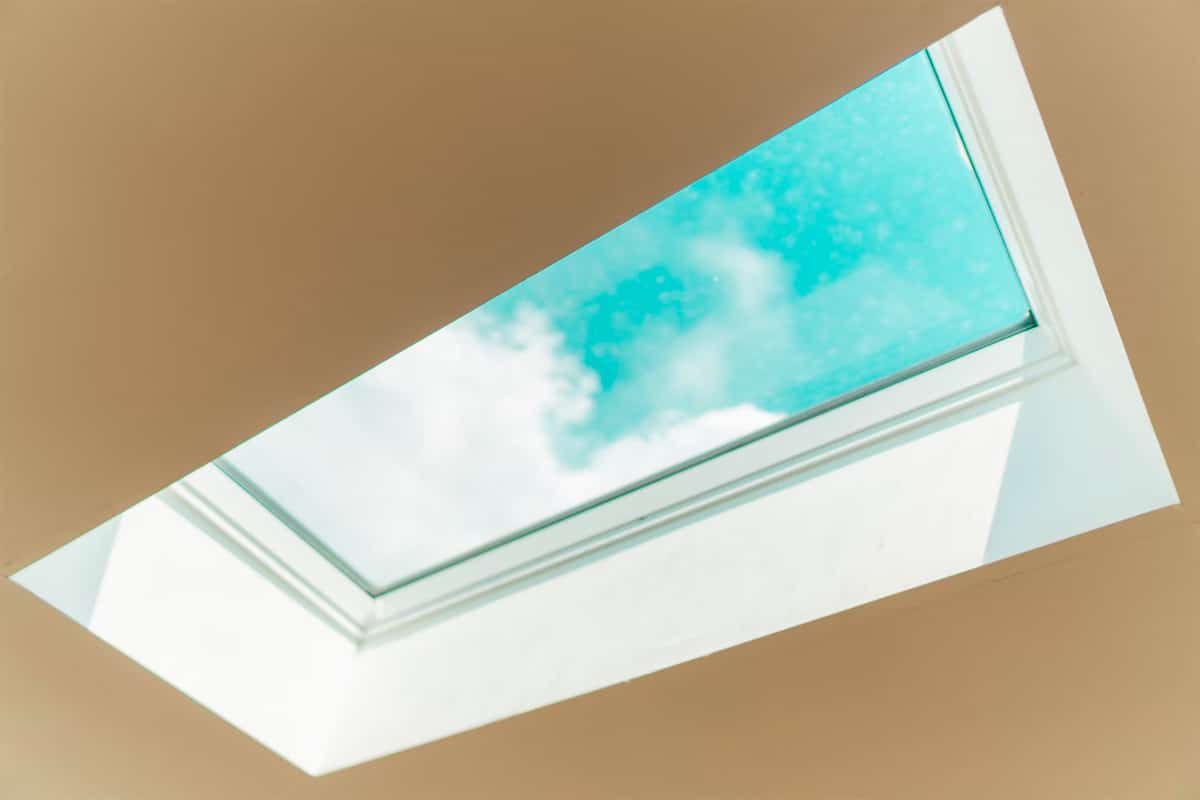 skylight on ceiling with clouds on a sunny day