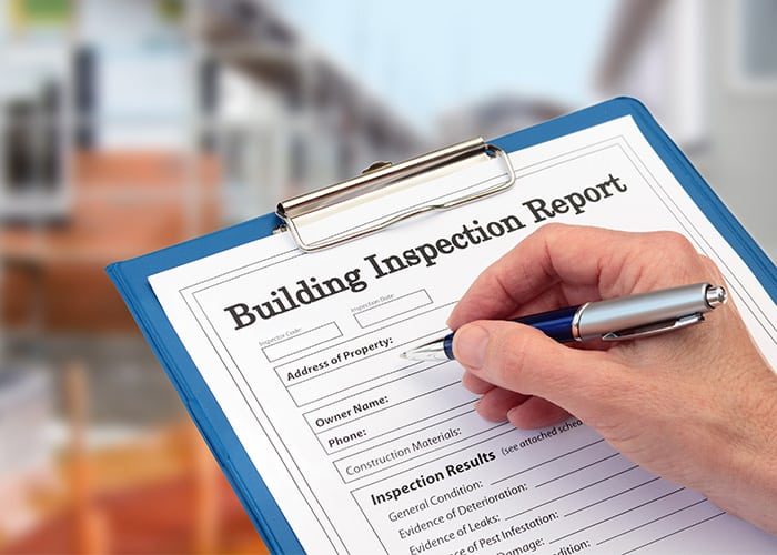 hand writing building inspection report