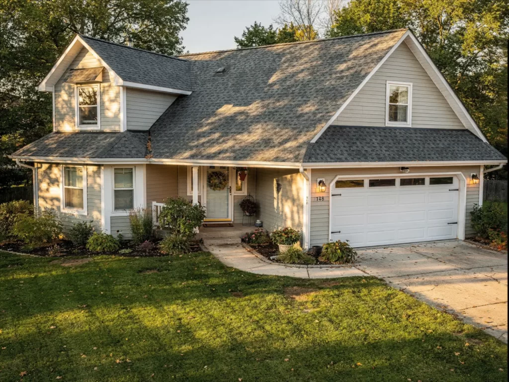 Home exterior with a new architectural shingle roof enhancing curb appeal and overall property appearance